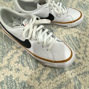 Nike White Sneakers with Black Logo and Tan Accents